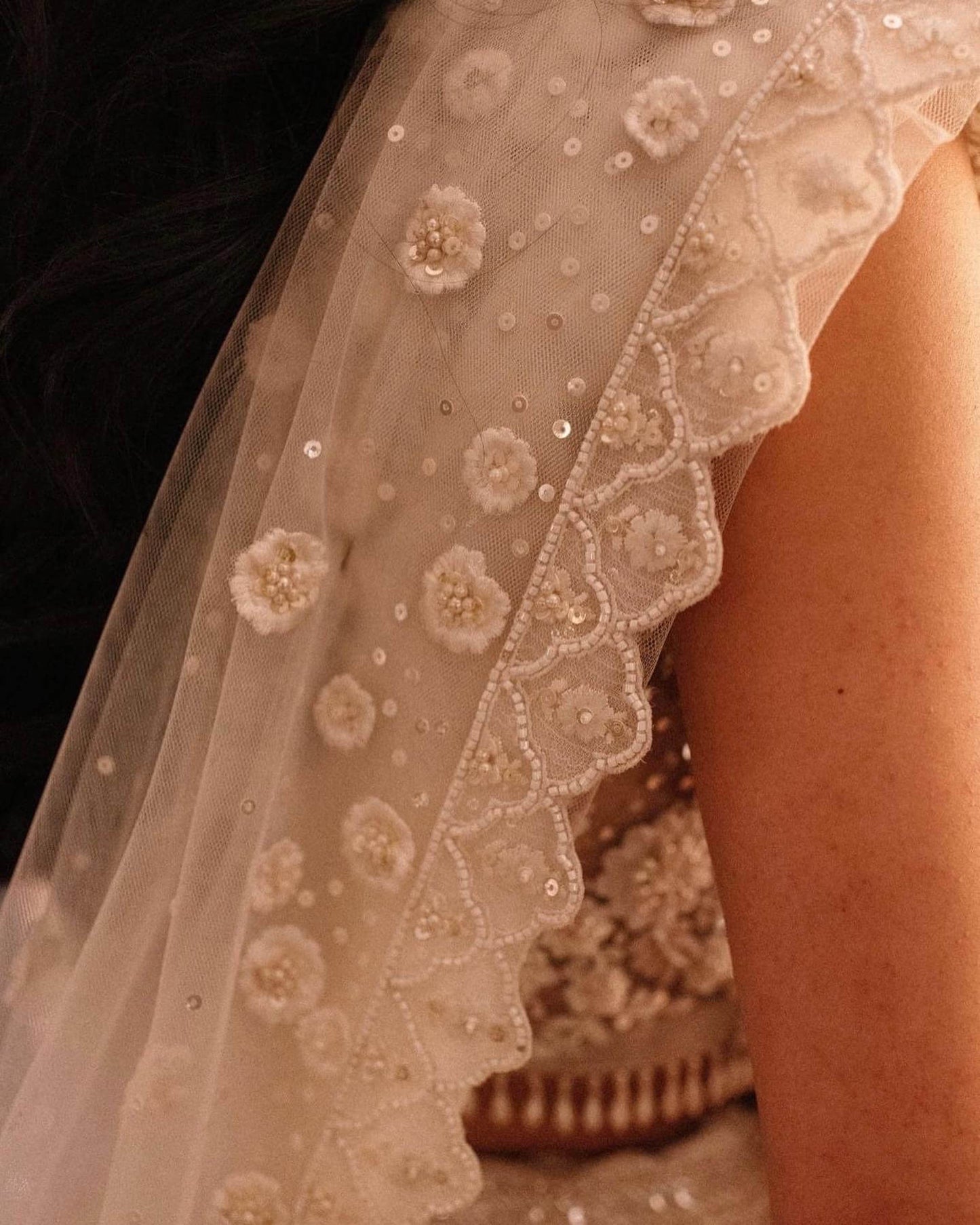 The Rucha Lehenga is a white hand-embroidered lehenga adorned with Swarovski crystals. It features a v-neck blouse with two tie details in the back. It comes with a completely detachable can-can.