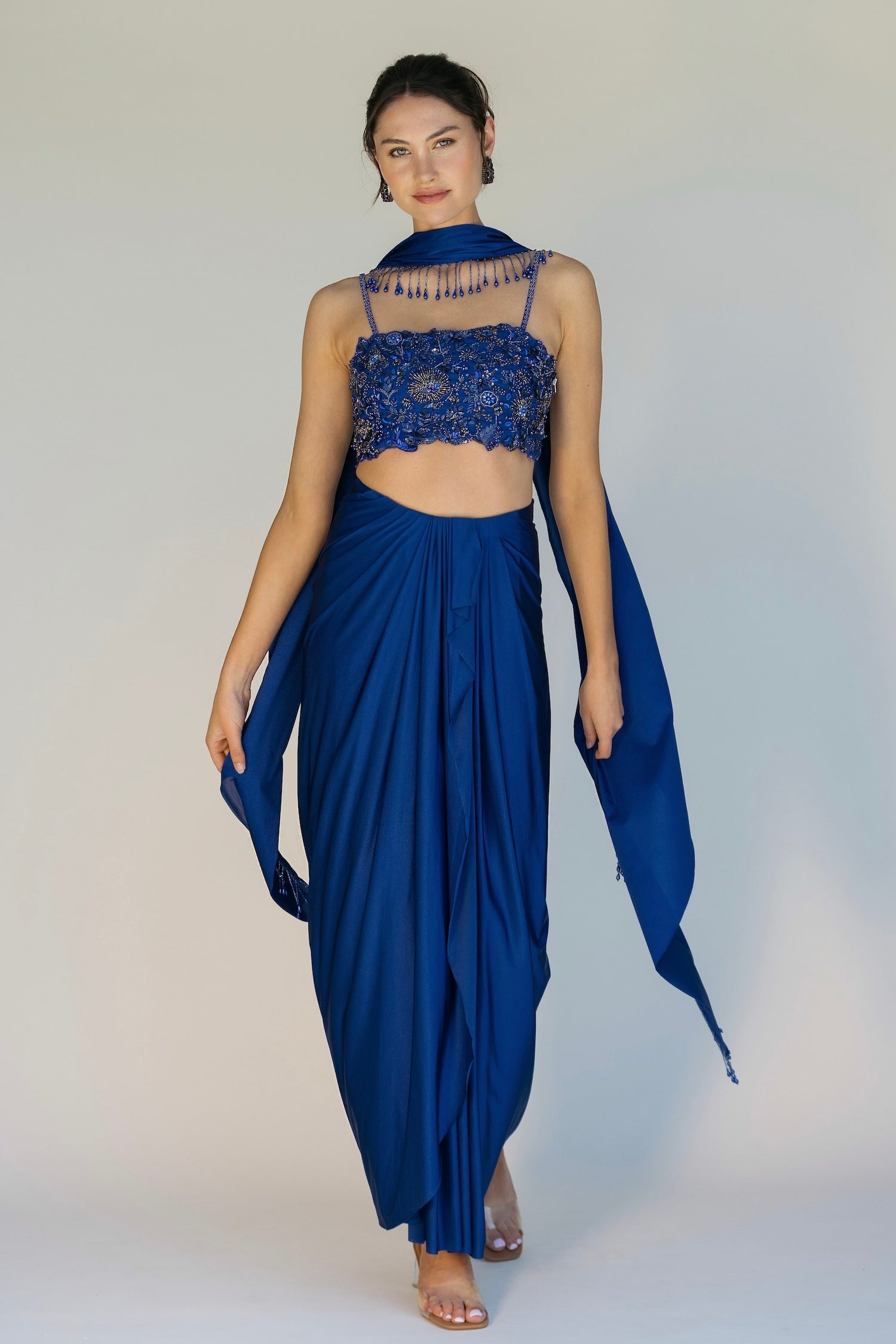 The Niki Set features a hand embroidered top, gathered skirt and skinny dupatta with pearl detailing.